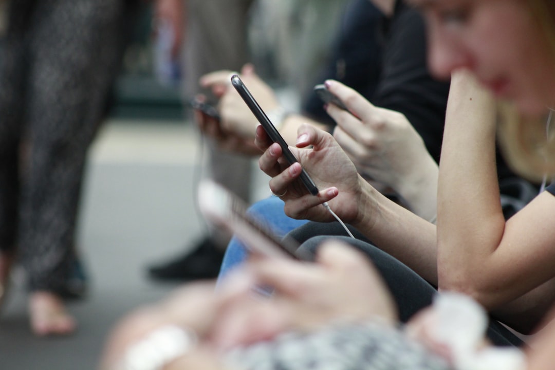 Person holding a black phone